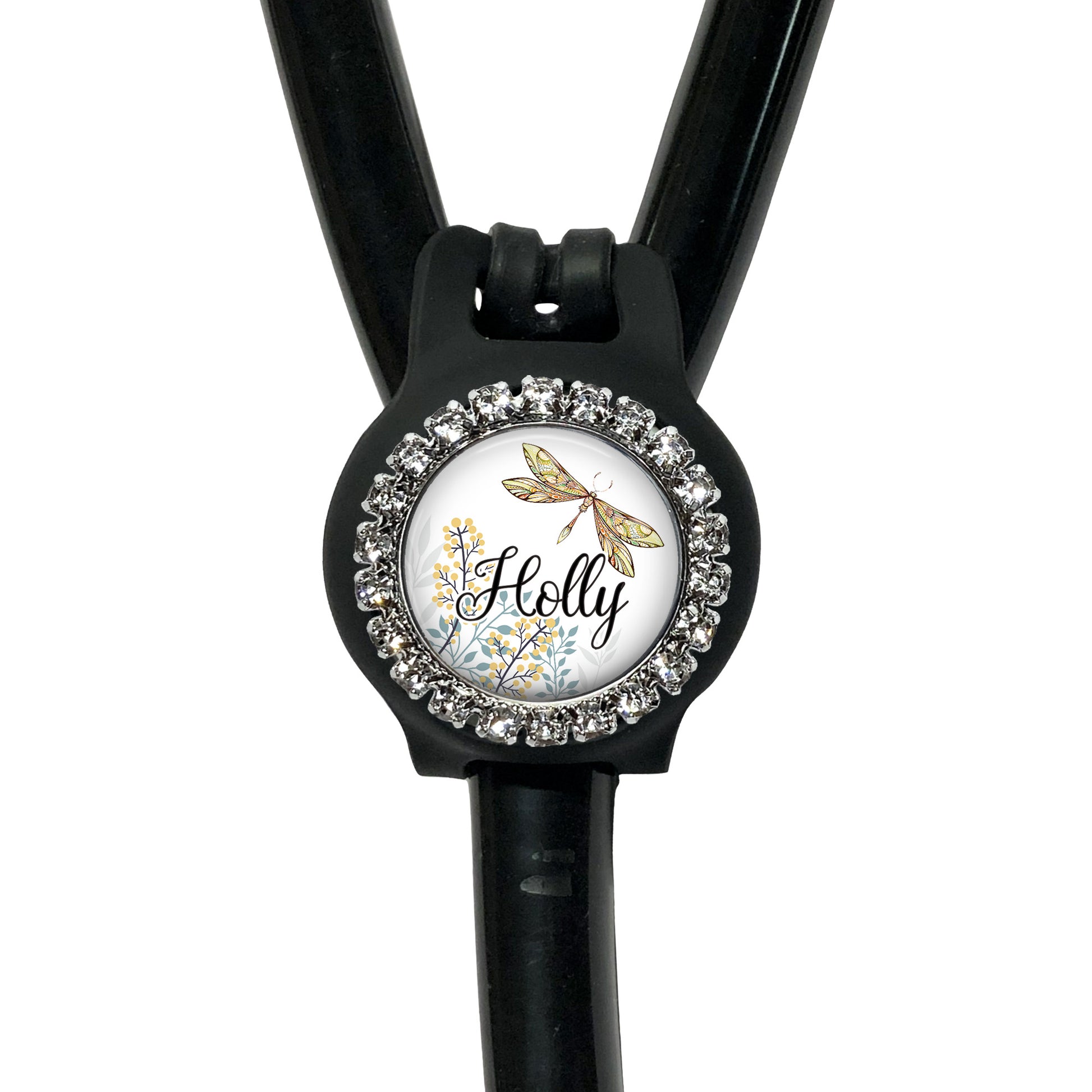 A black stethoscope with a personalized name badge attached to it.