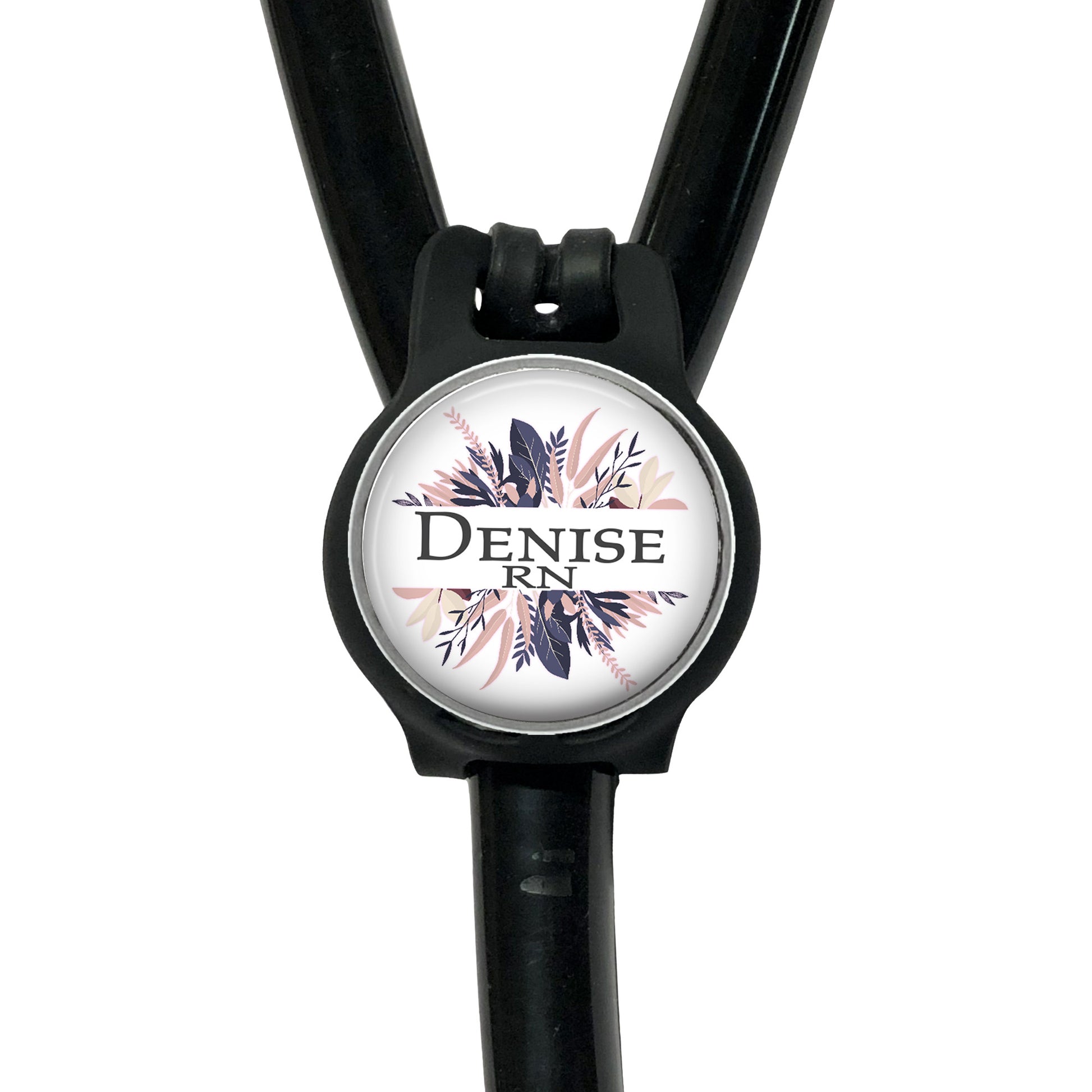 A black stethoscope with a round, personalized name badge attached to it.