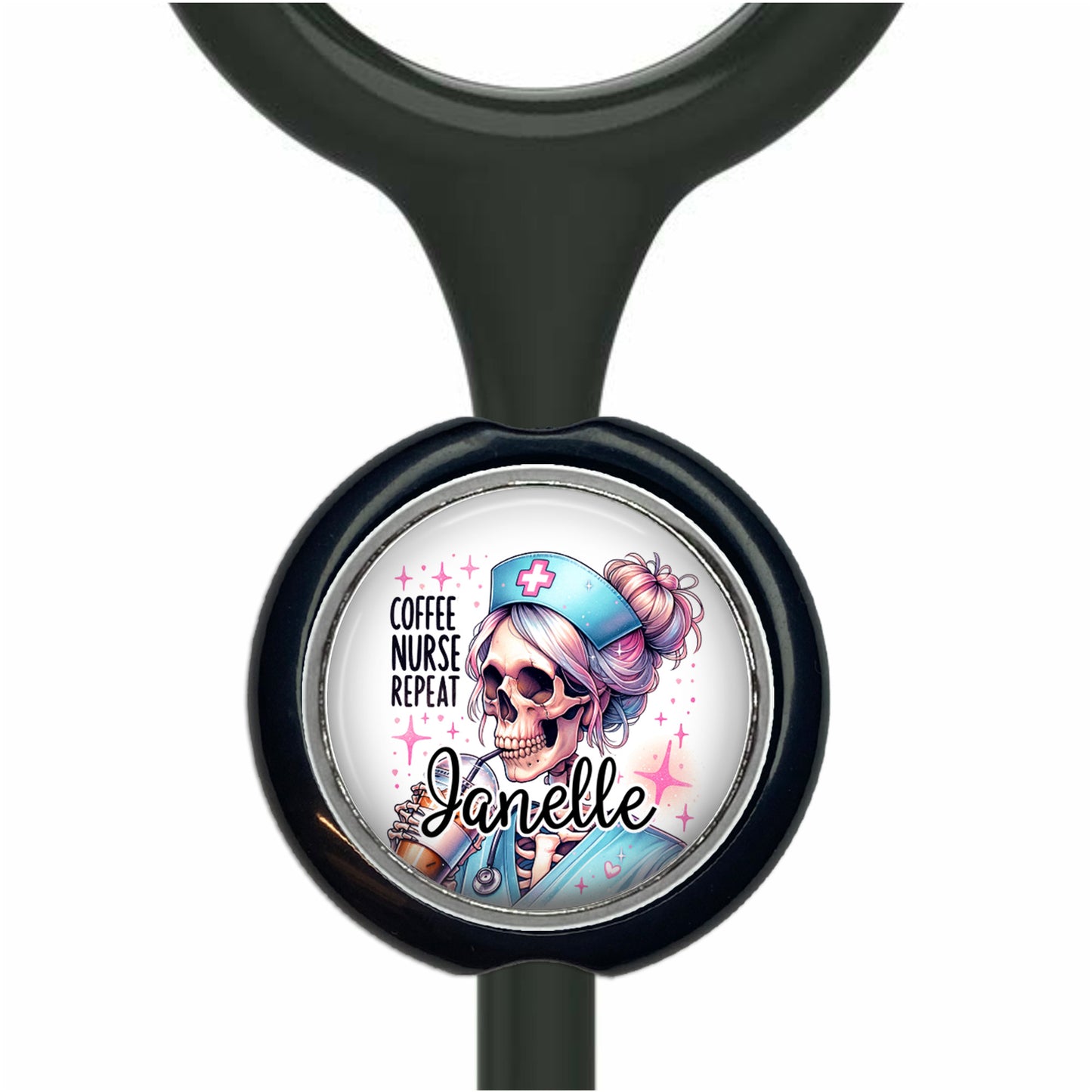 A black stethoscope with a round, personalized nameplate attached to it. The nameplate features a cartoon illustration of a skeleton nurse with a coffee cup in her hand, and the name "Janelle" is written below the illustration.
