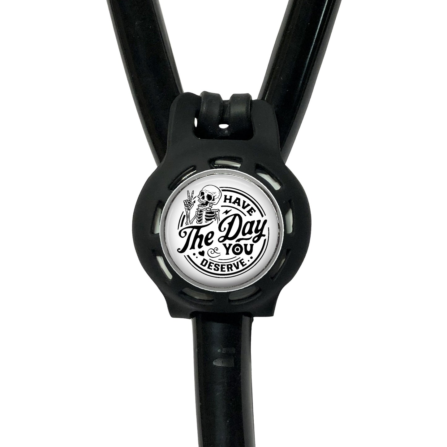 A black stethoscope with a circular badge on the handle that says "The Day You Deserve".