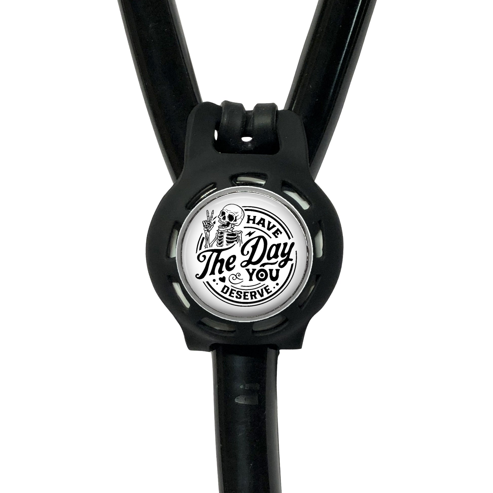 A black stethoscope with a circular badge on the handle that says "The Day You Deserve".