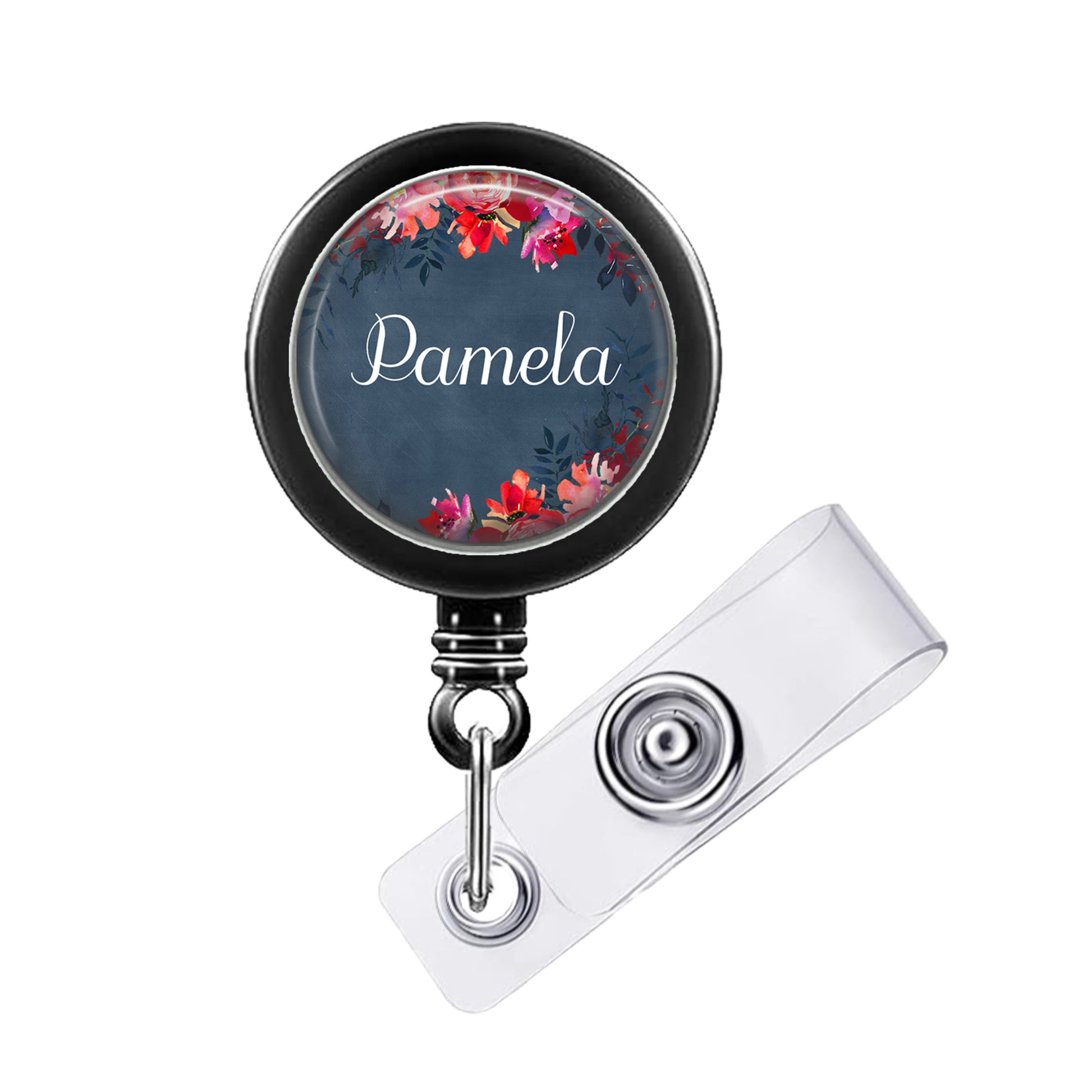 A black badge holder with a floral design and the name "Pamela" printed on it.