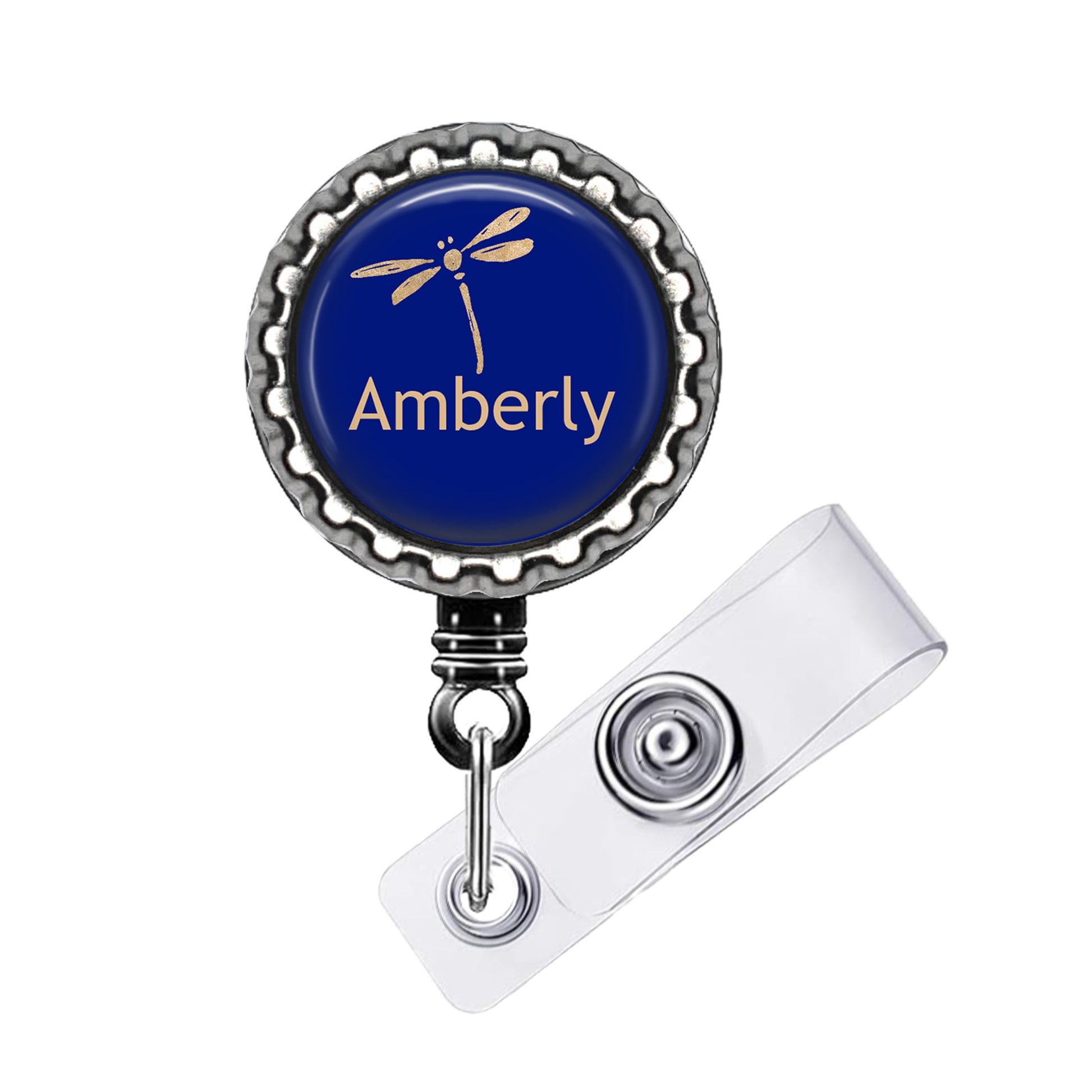 A blue badge with a dragonfly design and the word "Amberly" printed on it.