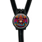A colorful, circular charm with a skull design and the word "Irish" written on it, attached to a black strap.
