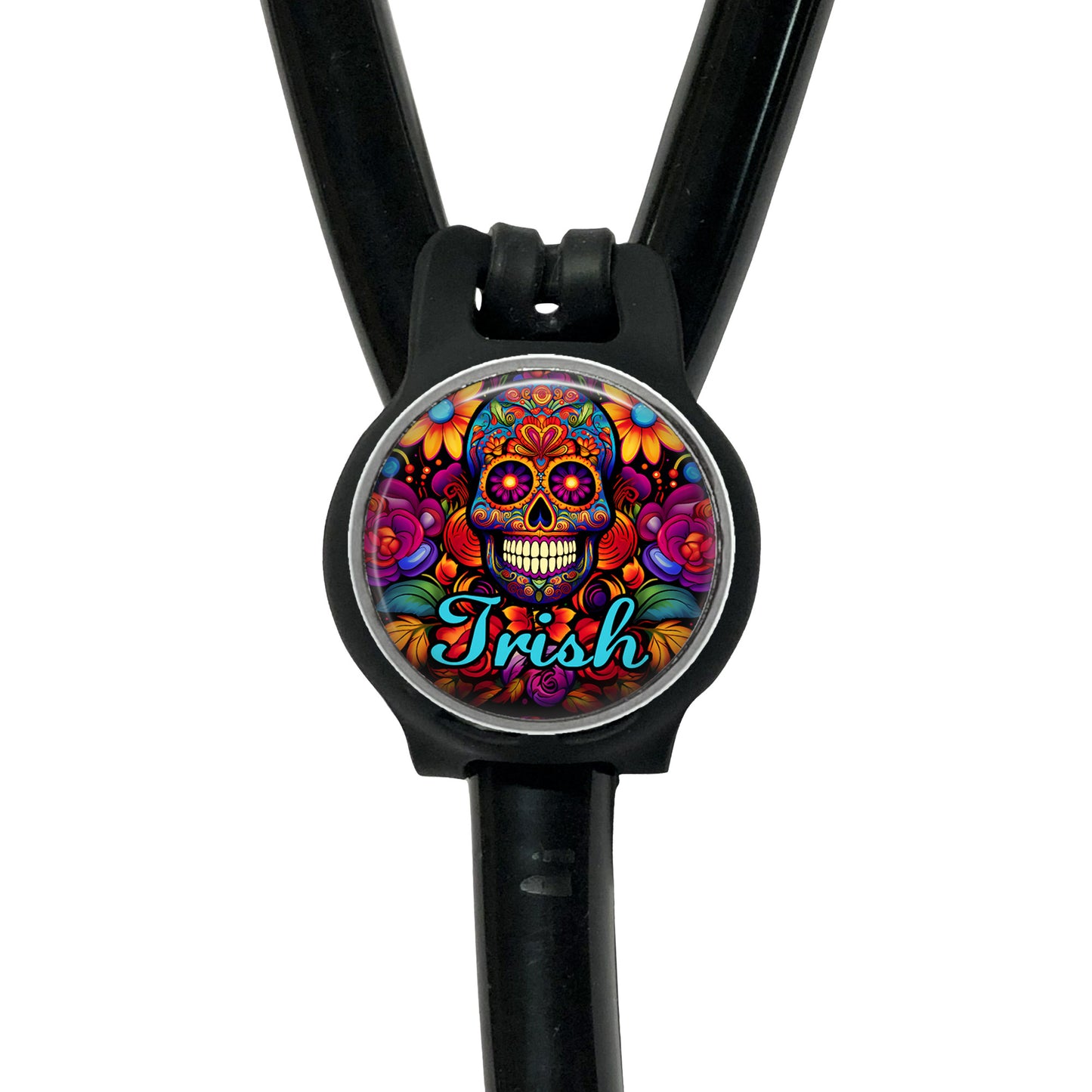 A colorful, circular charm with a skull design and the word "Irish" written on it, attached to a black strap.