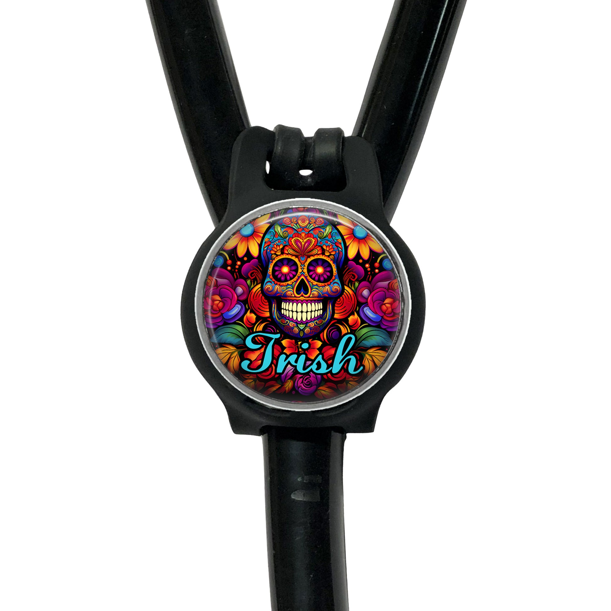 A colorful, circular charm with a skull design and the word "Irish" written on it, attached to a black strap.