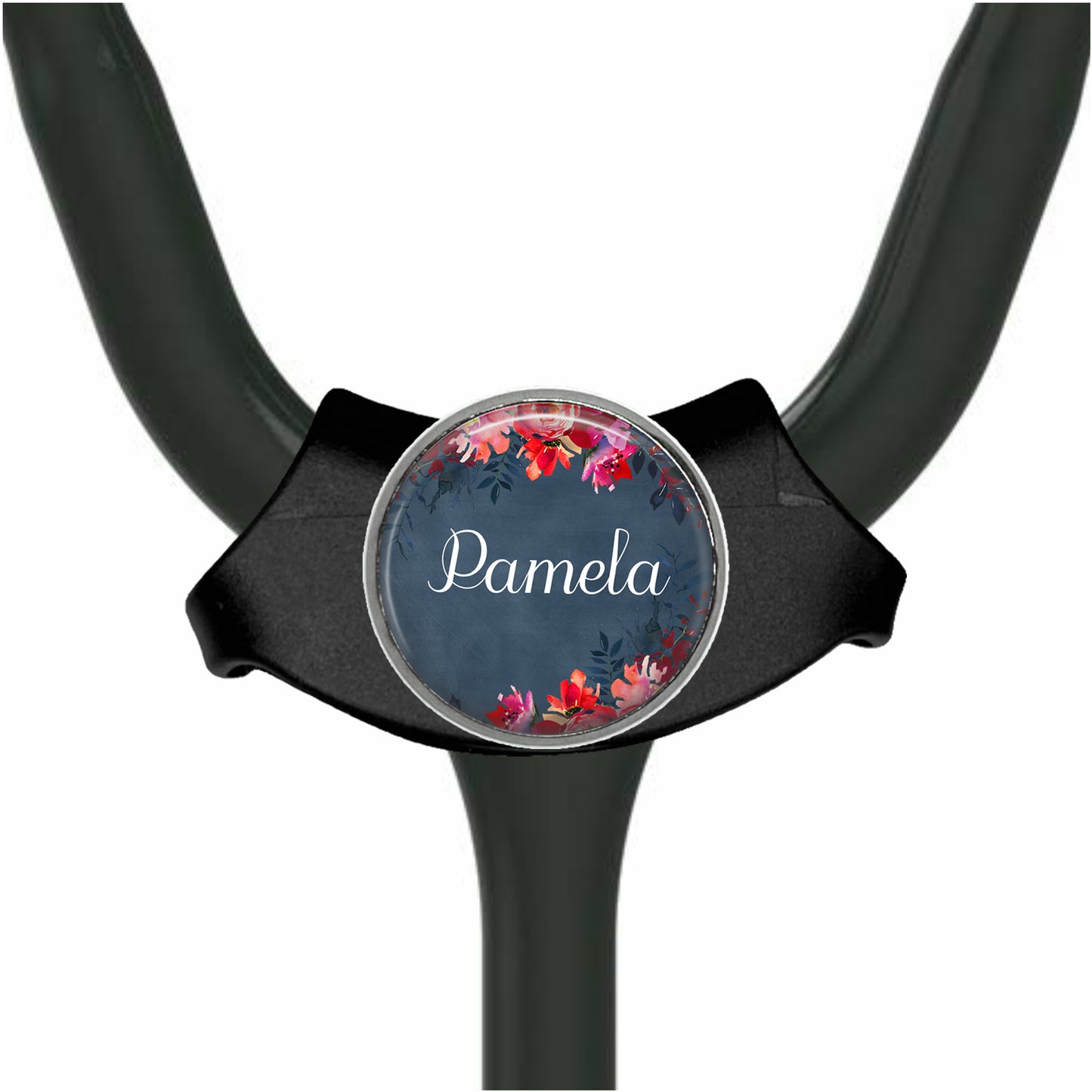 A black stethoscope with a round, floral-designed name tag attached to it.