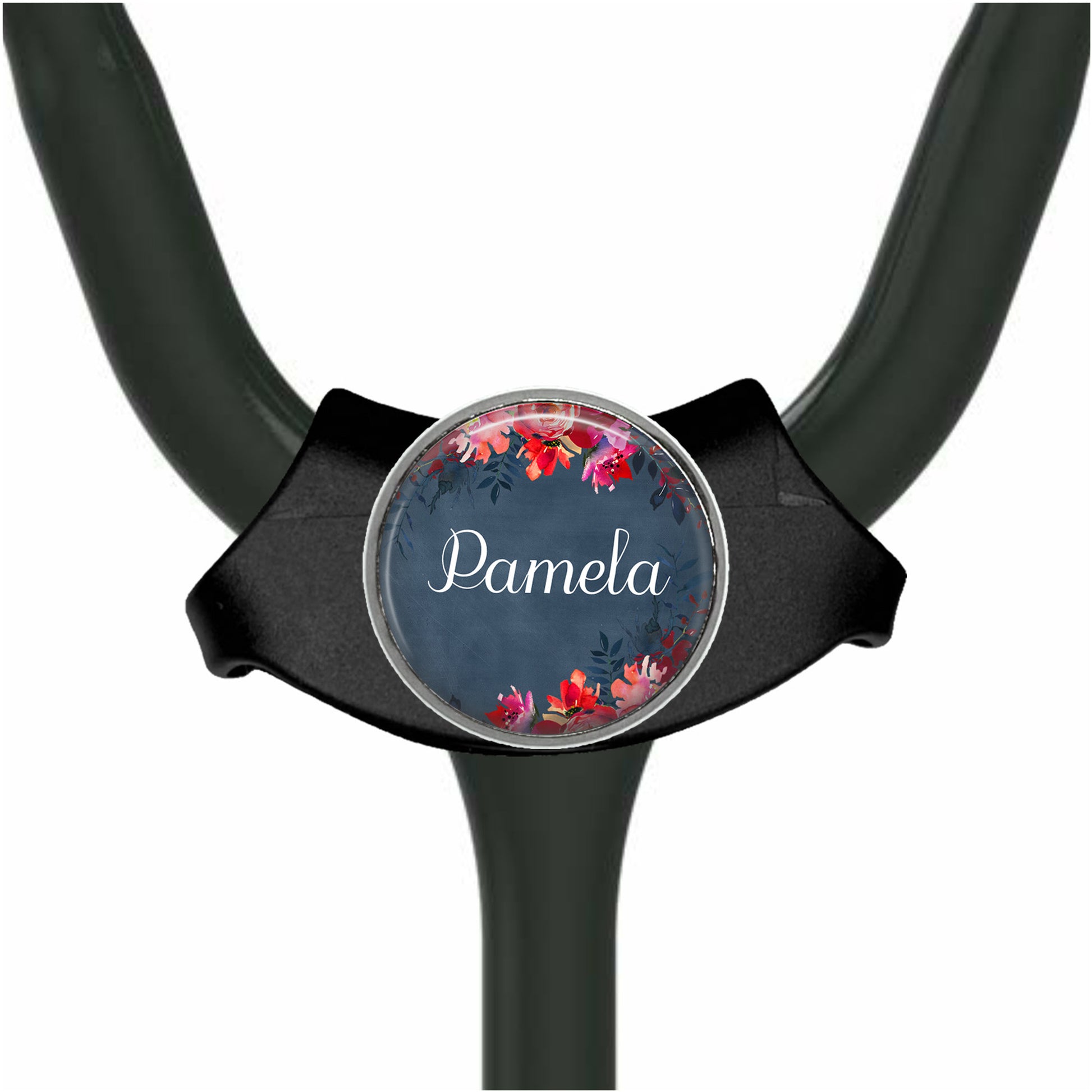 A black stethoscope with a round, floral-designed name tag attached to it.