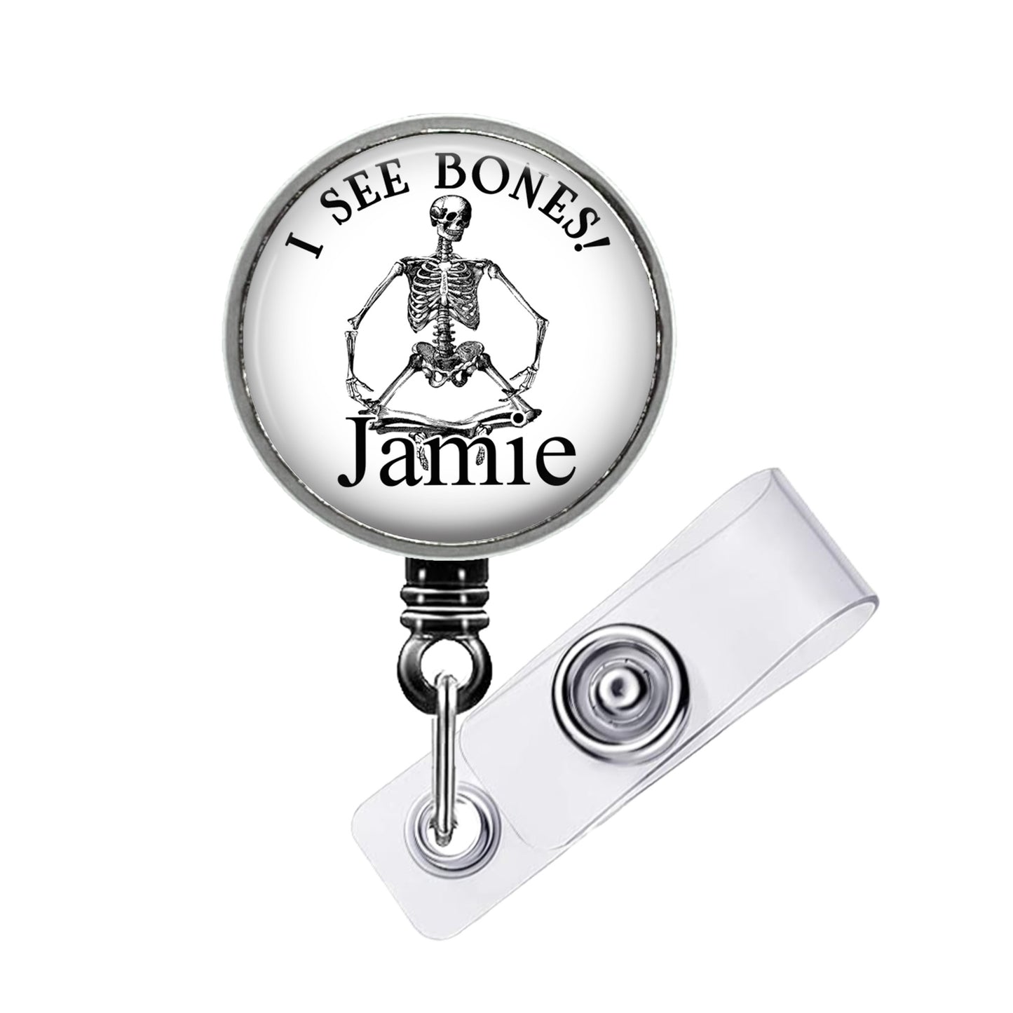 A skeleton badge with the text "I SEE BONES! Jamie" printed on it.