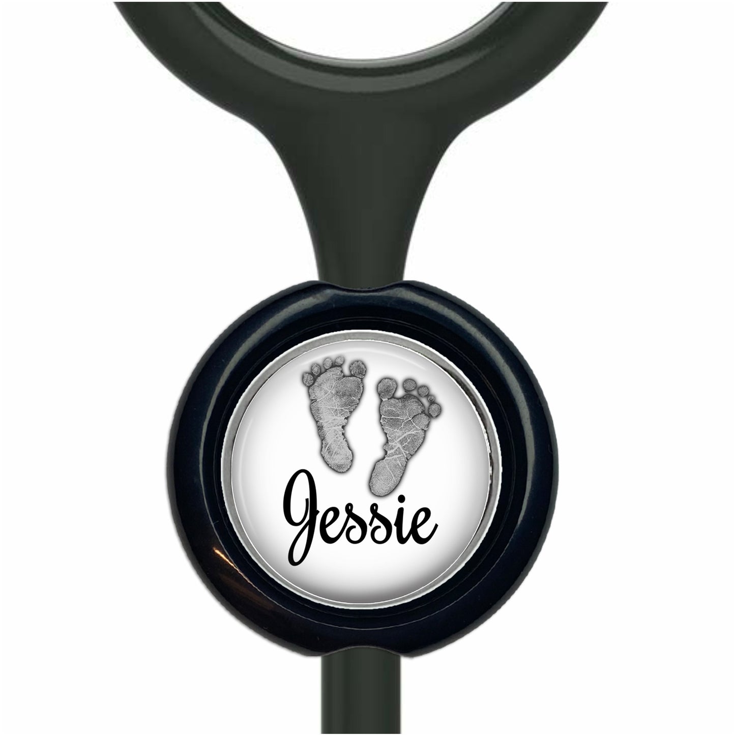 A black stethoscope with a round black button featuring a white image of a baby's foot and the name " Jessie" written below it.