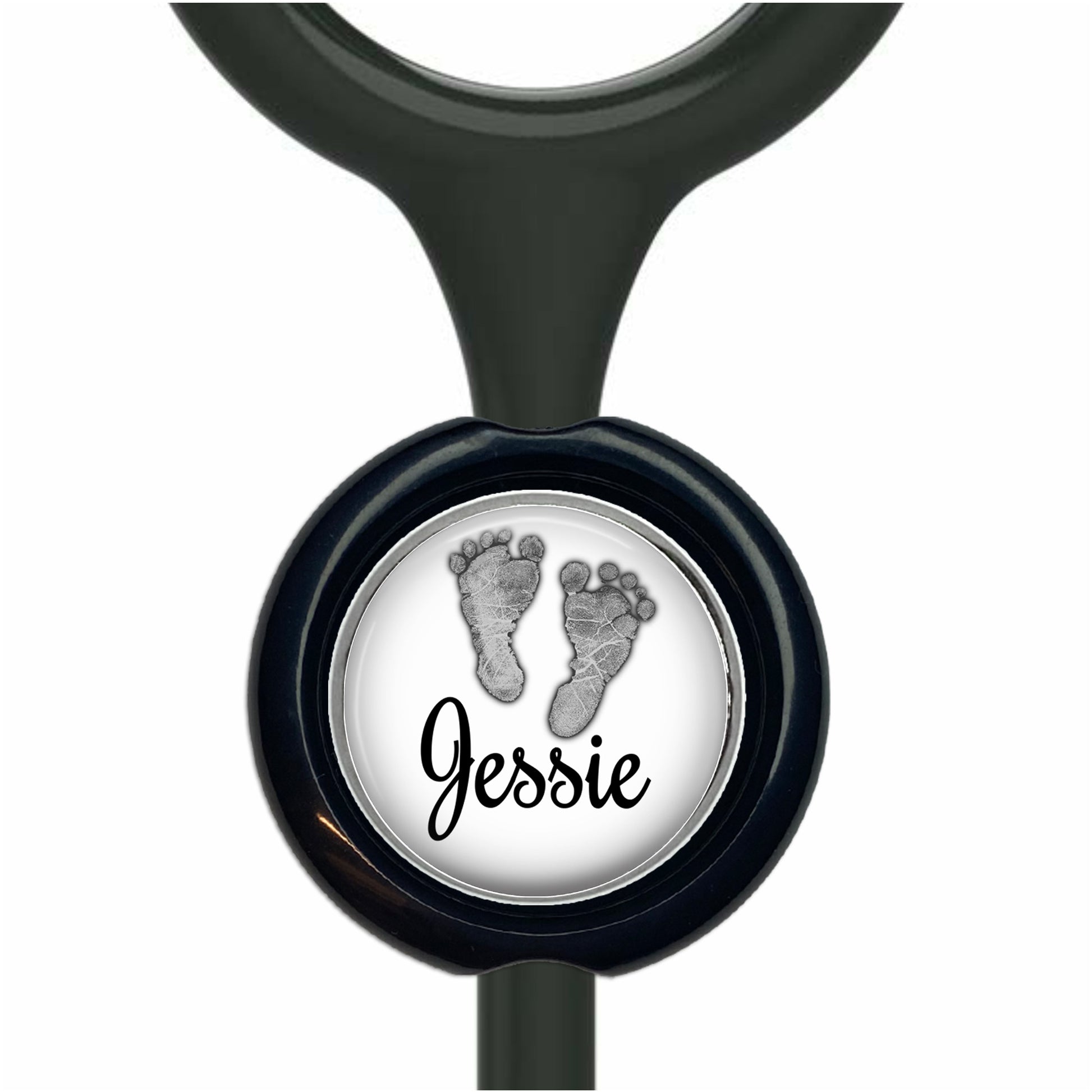 A black stethoscope with a round black button featuring a white image of a baby's foot and the name " Jessie" written below it.