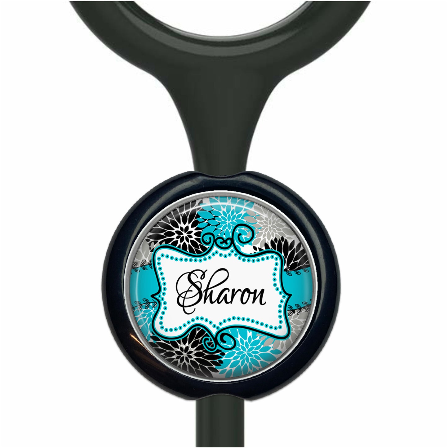 A black and blue decorative charm with the name "Sharon" written on it.