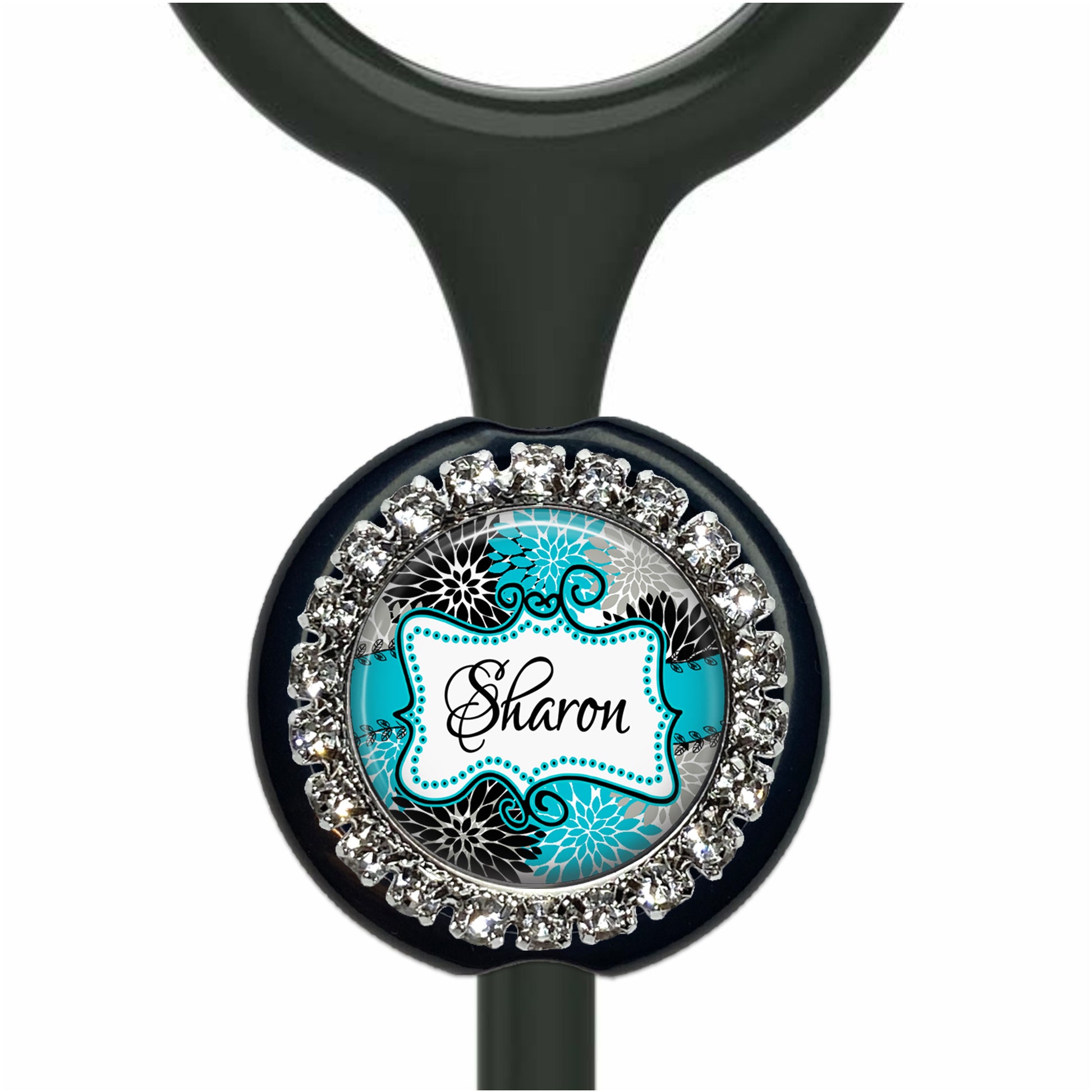 A personalized nameplate with a black background and a blue and white floral design.
