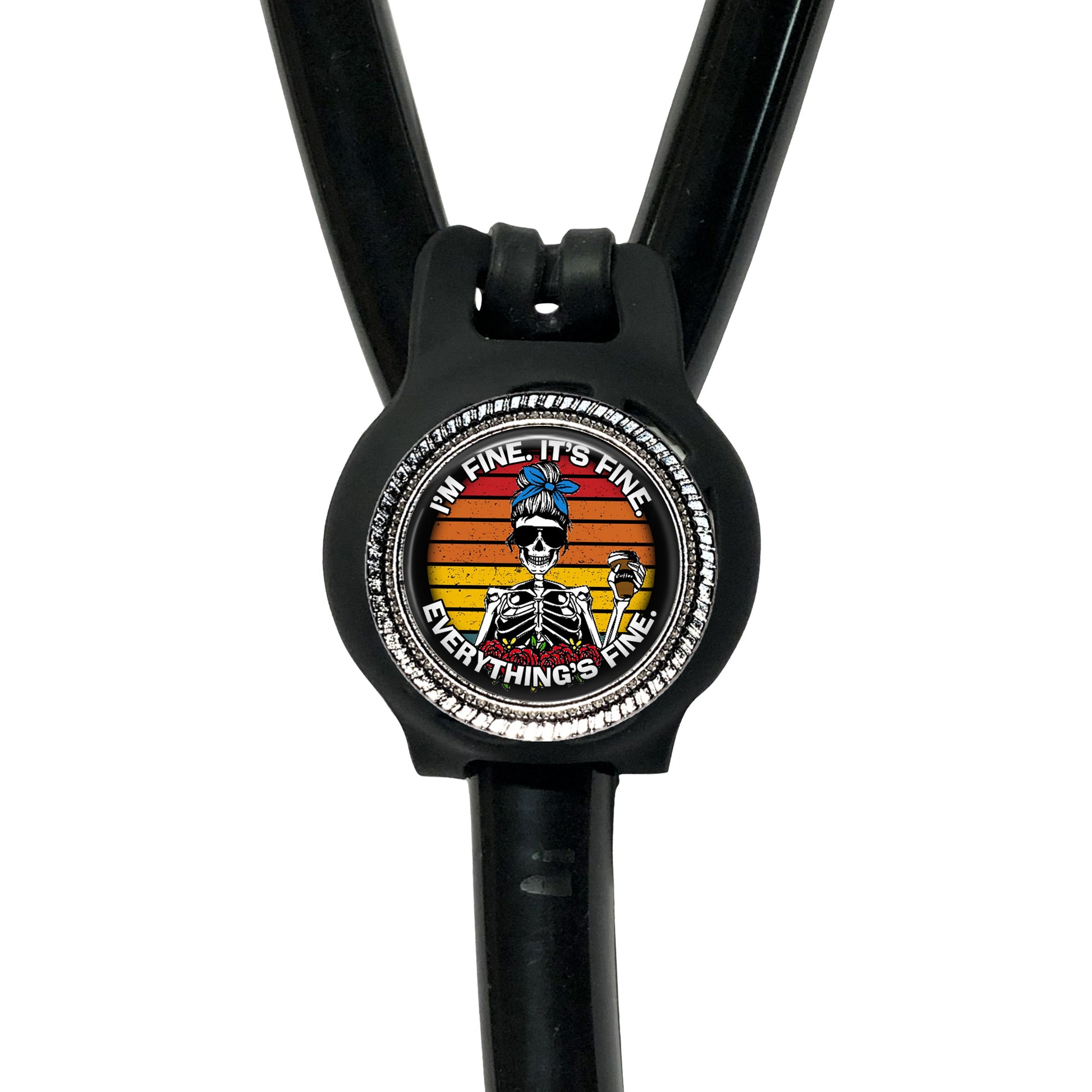 A black stethoscope with a colorful, skull-themed badge on it.