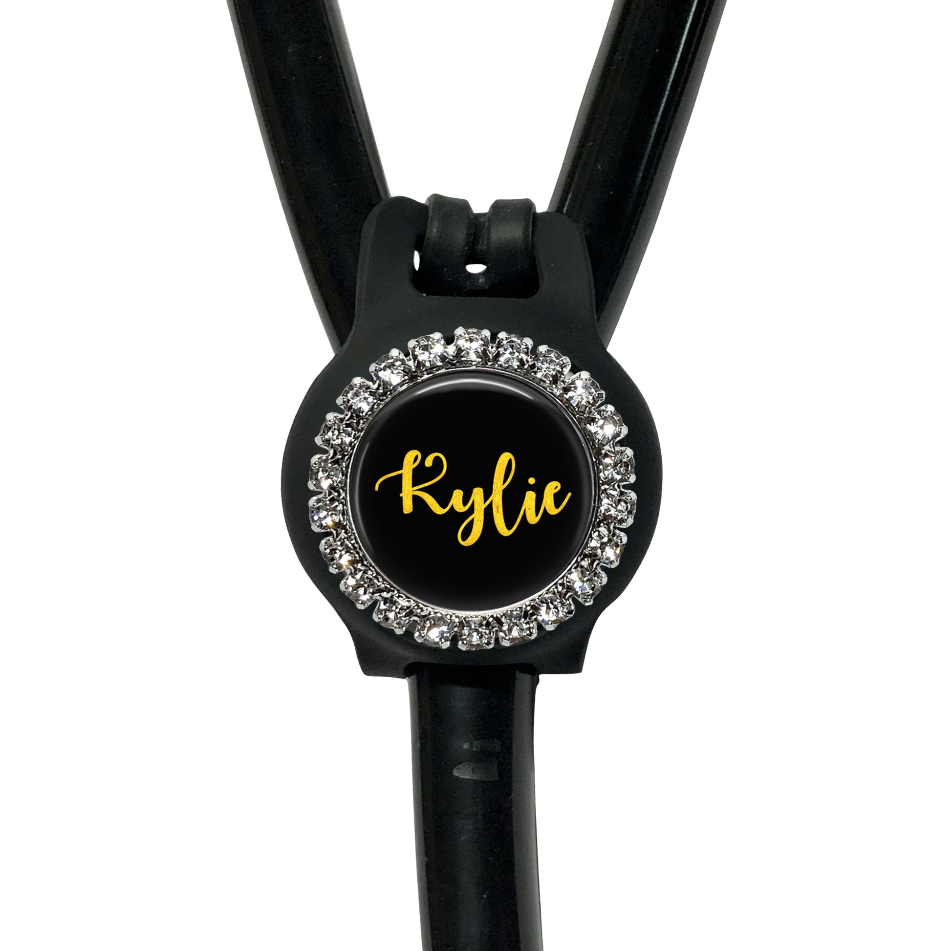 A black stethoscope with a personalized name badge attached to it.