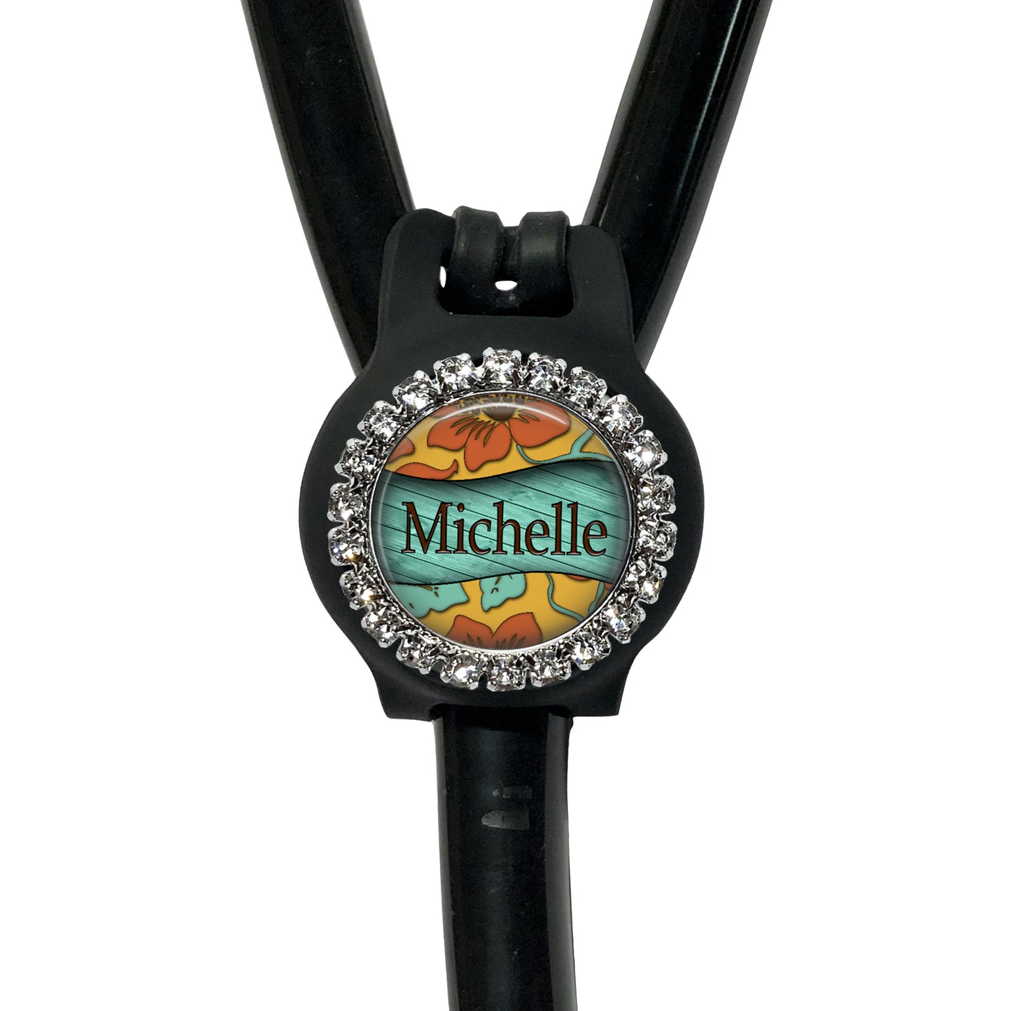 A black stethoscope with a personalized name badge attached to it.