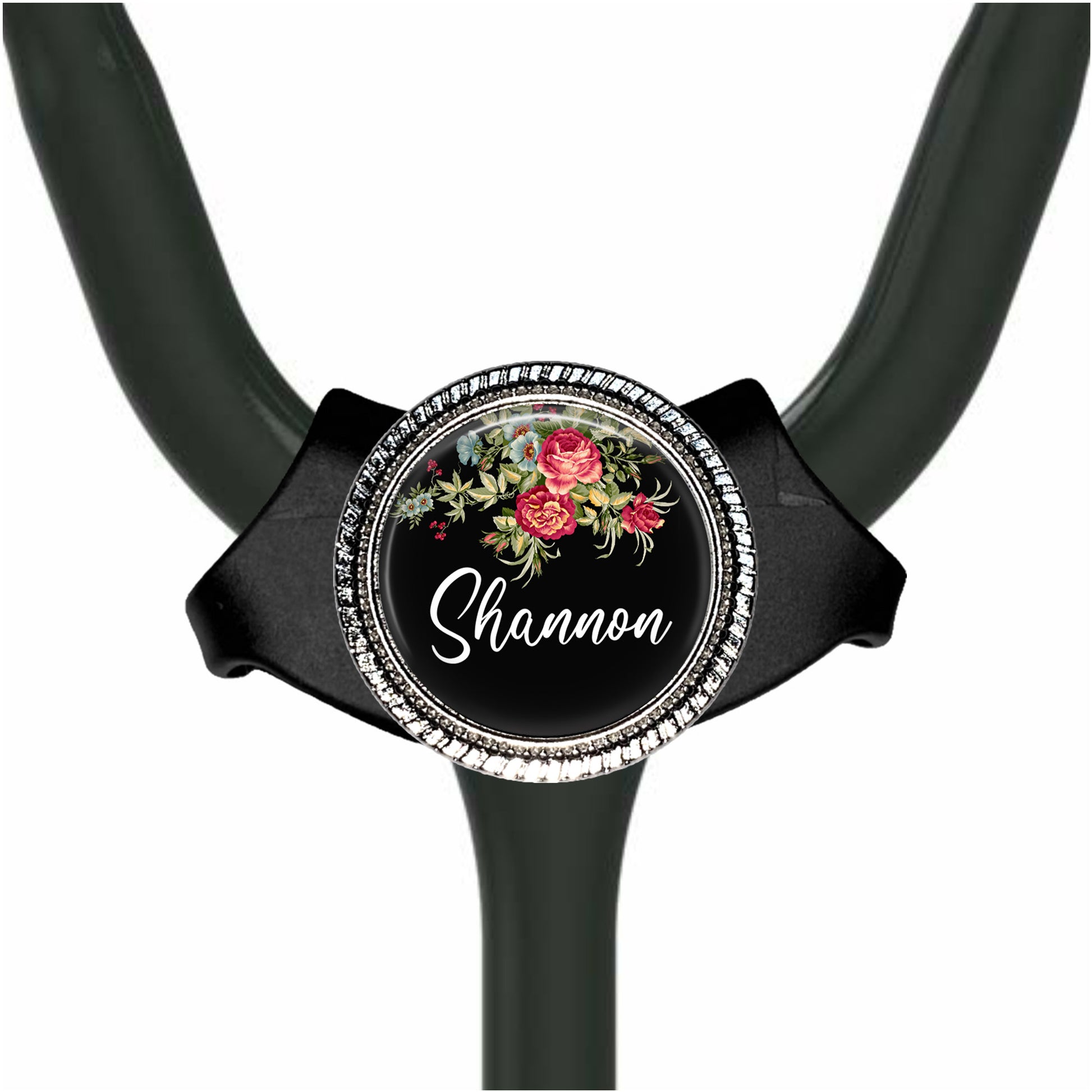 A black stethoscope with a personalized name badge on it.