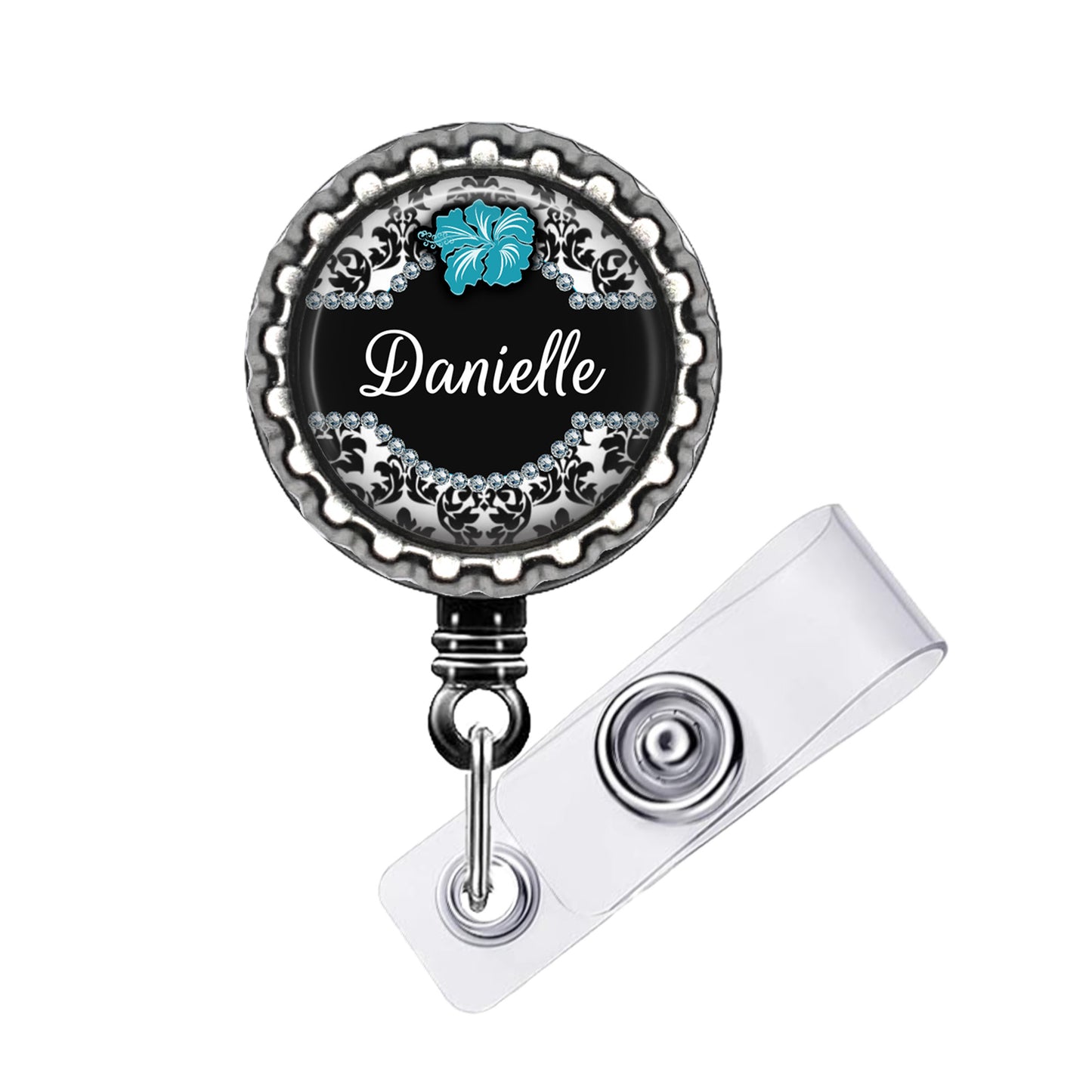 A black and silver badge holder with a name tag attached to it.