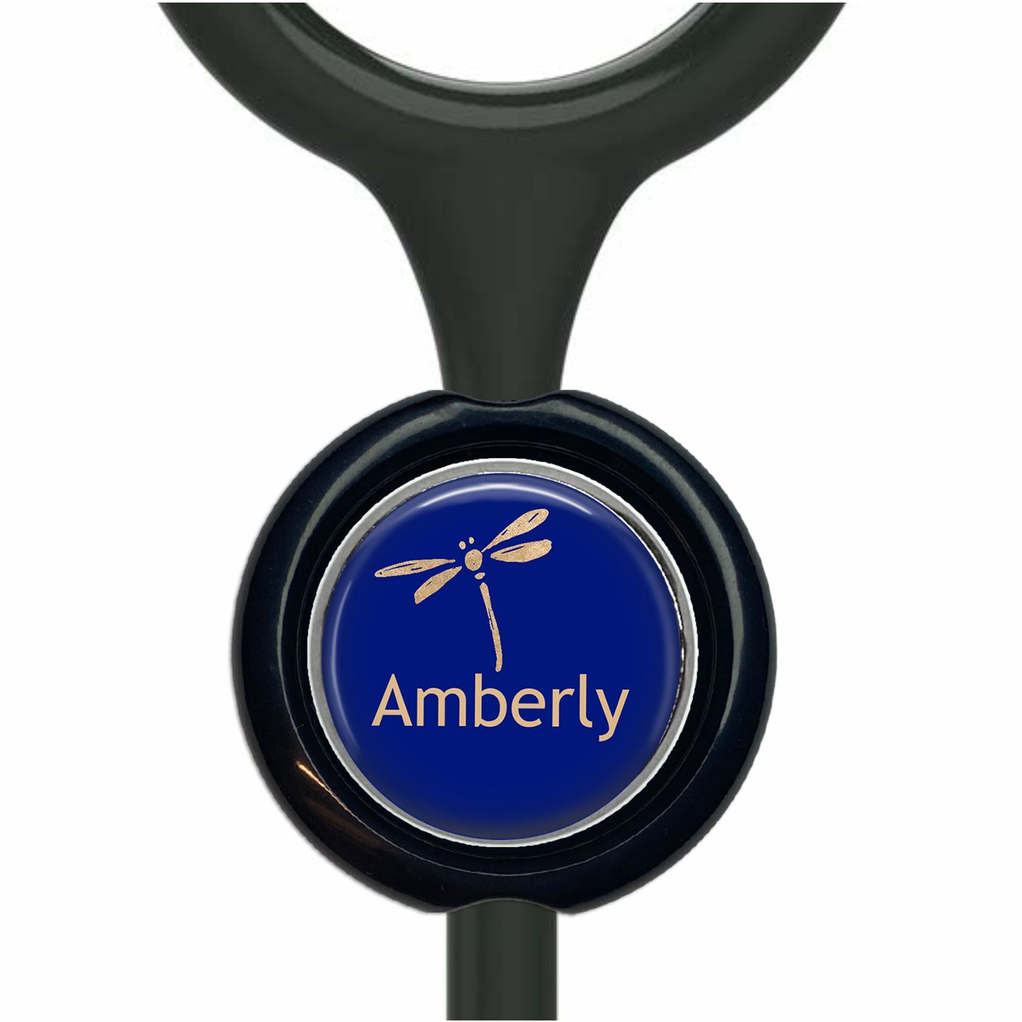 A blue button with a dragonfly design, featuring the word "Amberly" written on it.