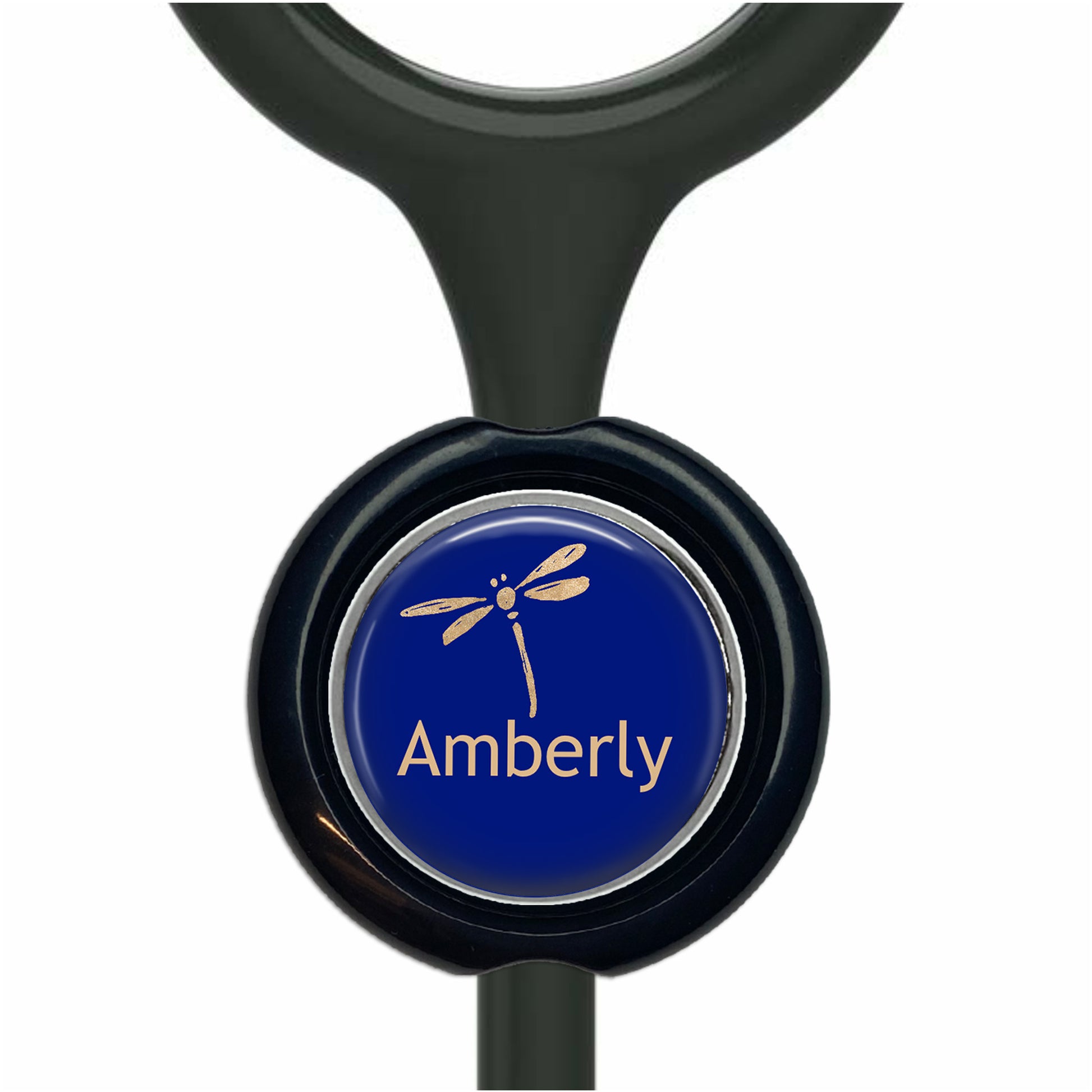 A blue button with a dragonfly design, featuring the word "Amberly" written on it.