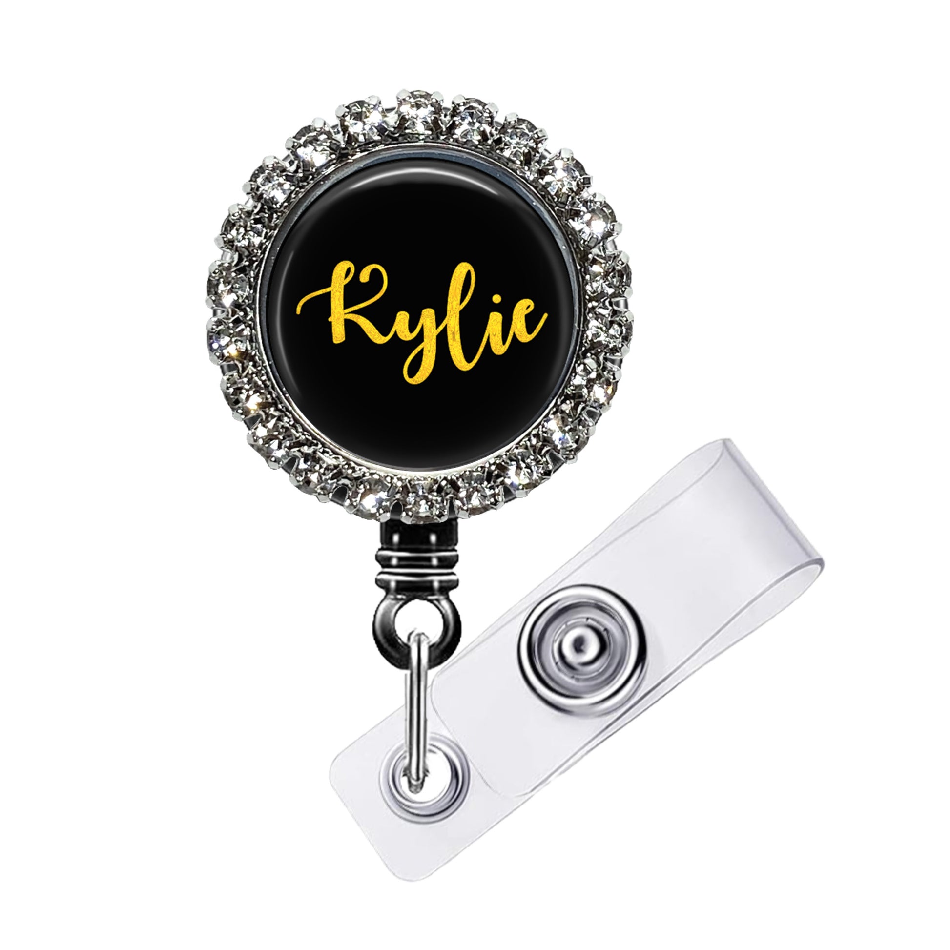 A black and silver badge holder with a personalized name badge attached to it.