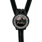 A black stethoscope with a personalized name badge attached to it.