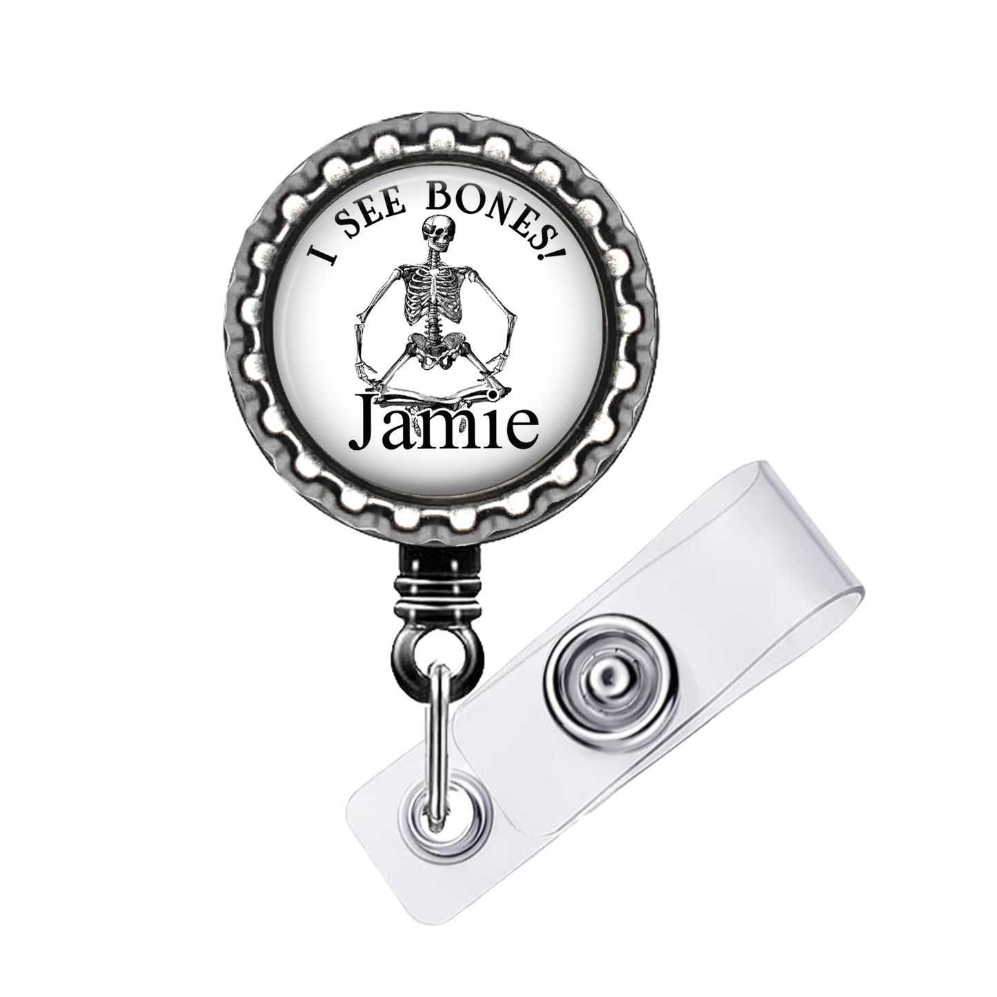 A skeleton badge with the text "I SEE BONES! Jamie" printed on it.