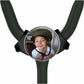 A young boy wearing a helmet is smiling at the camera, with a stethoscope attached to the top of the stethoscope handle.