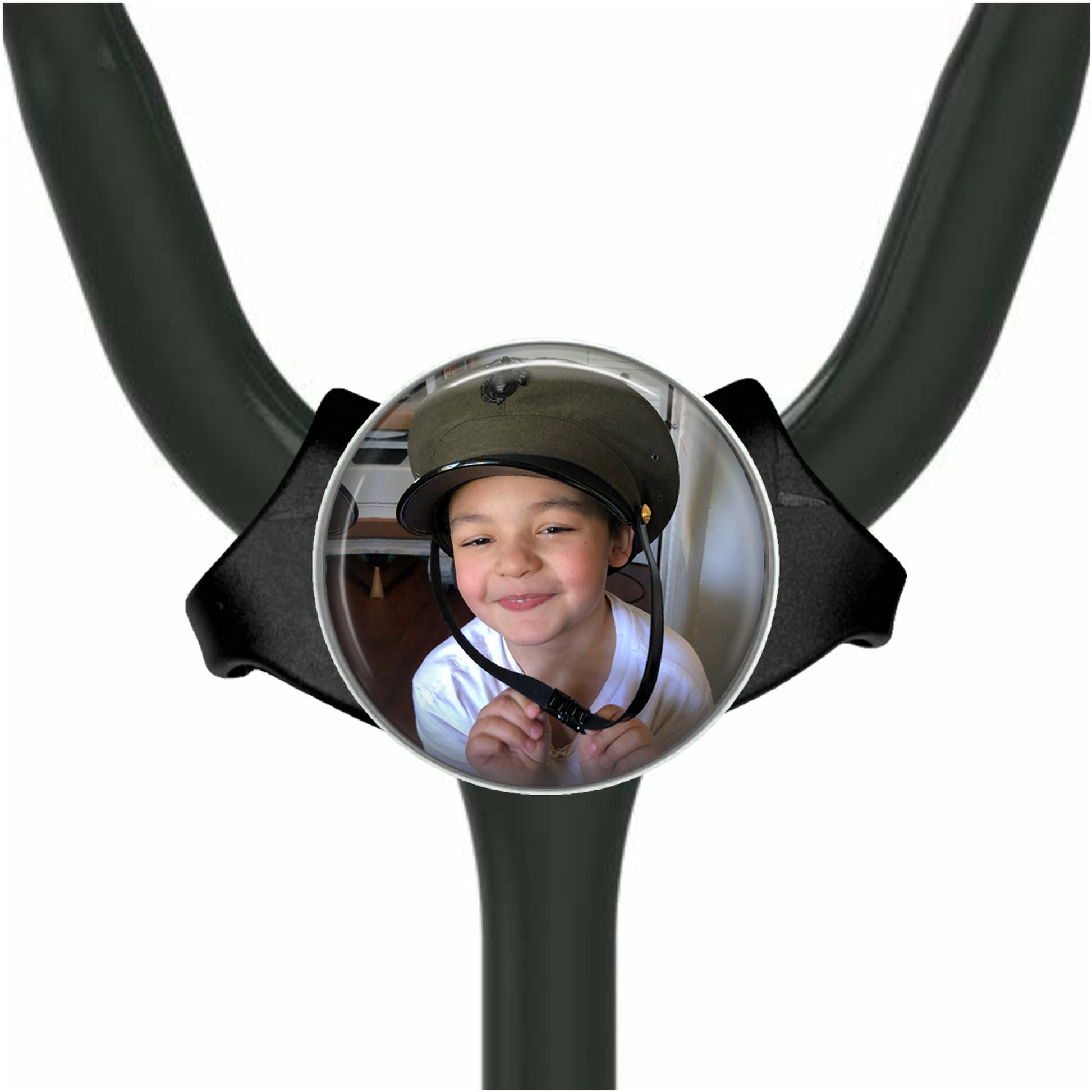A young boy wearing a helmet is smiling at the camera, with a stethoscope attached to the top of the stethoscope handle.