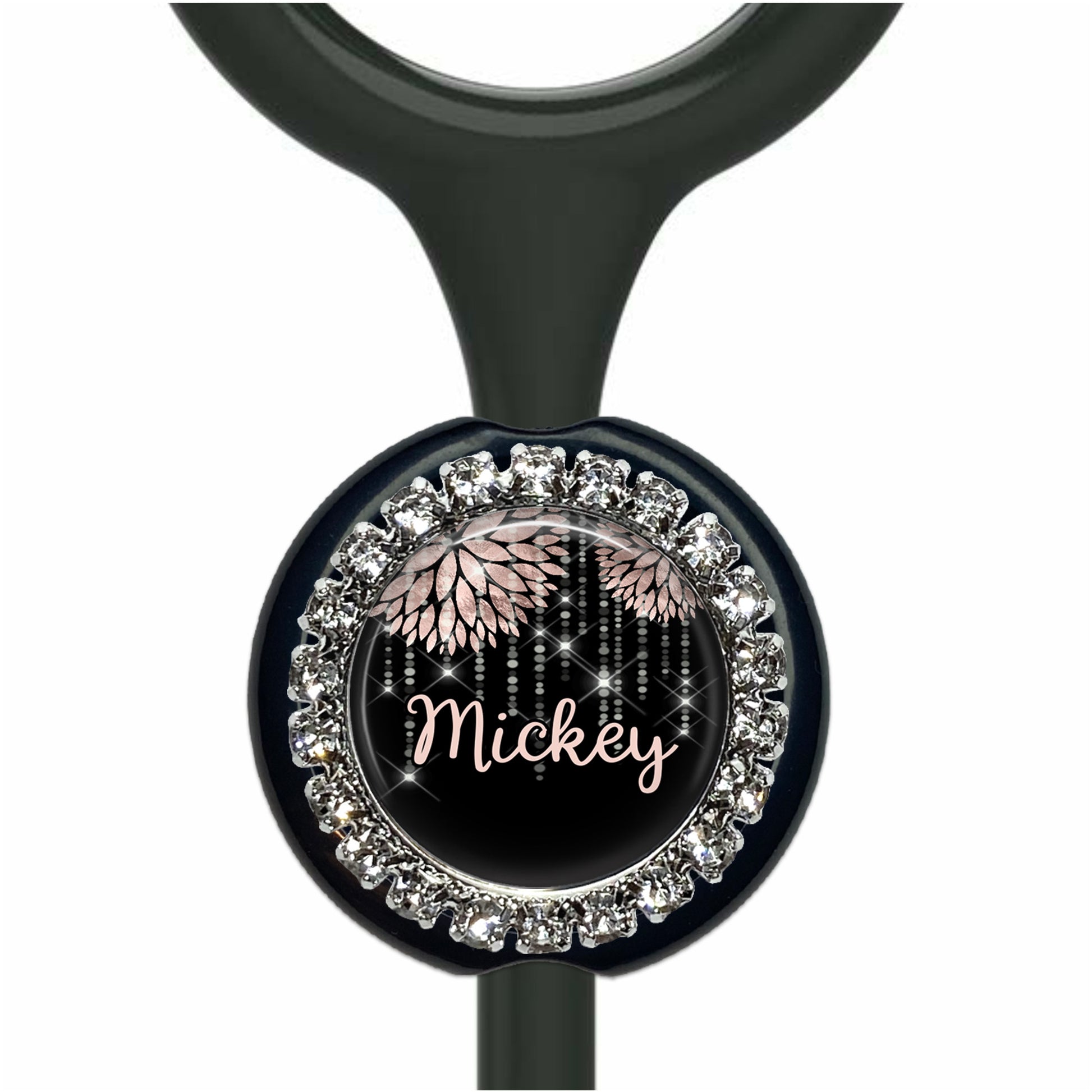 A black and silver medical device with a personalized nameplate.