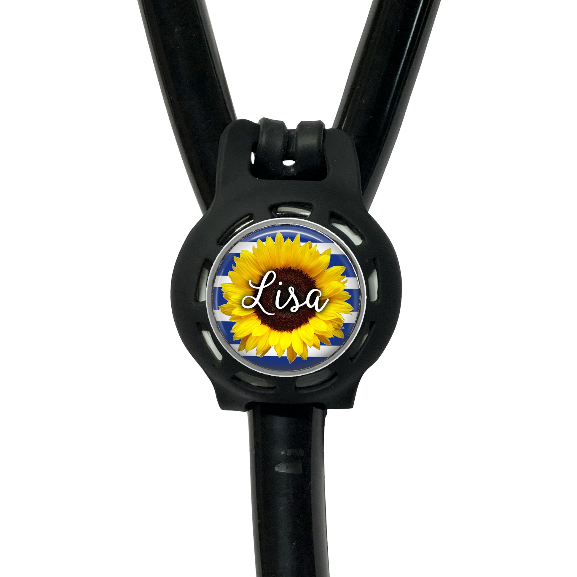 A black stethoscope with a personalized nameplate attached to it. The nameplate features a sunflower design and the name "Lisa".
