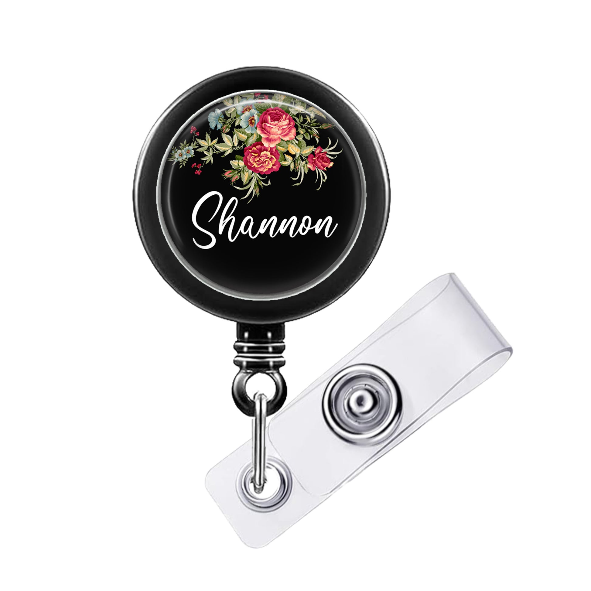 A black badge holder with a floral design and the name "Shannon" written on it.