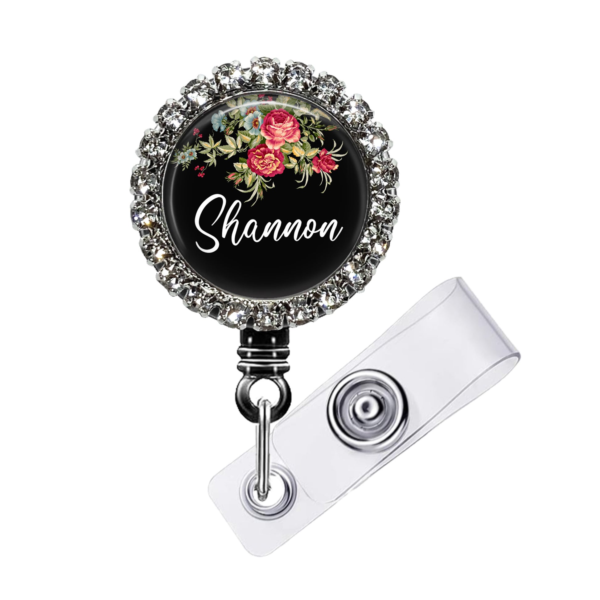 A black lanyard with a floral design and a name tag attached to it.