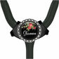 A black stethoscope with a personalized name badge on it.