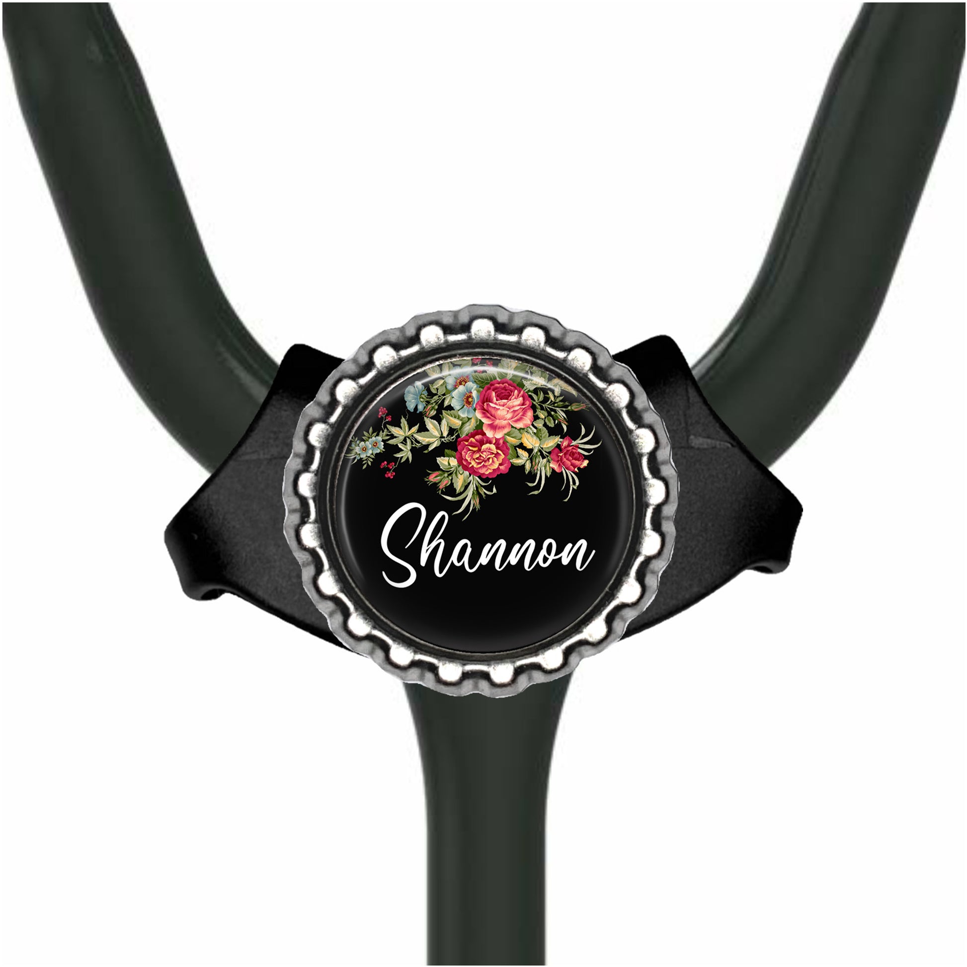 A black stethoscope with a personalized name badge on it.