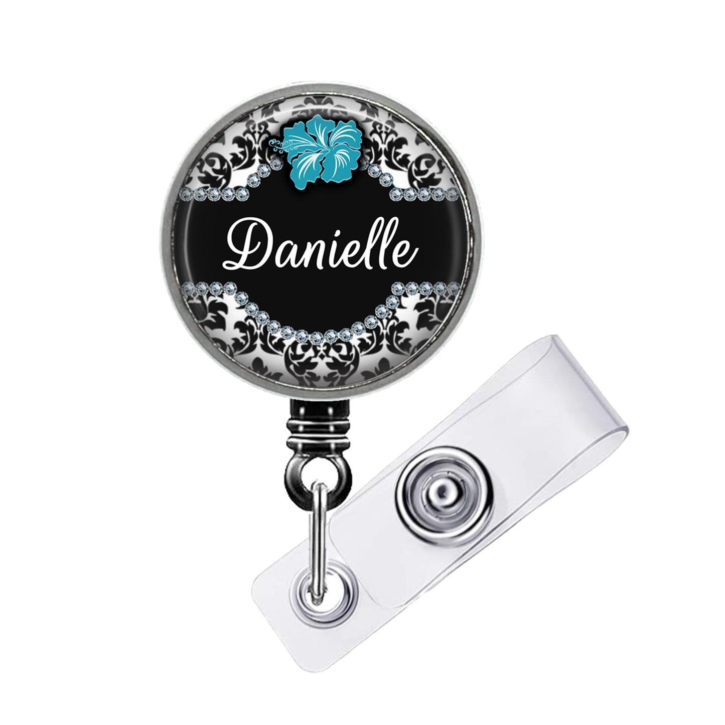 A black and silver badge holder with a name tag attached to it.