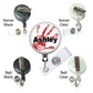a variety of badge holders and swivel clips, each with different colors and designs. The main focus is a badge holder with a red handprint and the name "Ashley" printed on it.