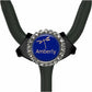 A stethoscope with a blue and gold rhinestone-encrusted circular badge that says "Amberly".