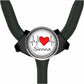 A black stethoscope with a round badge on the handle, featuring a red heart and the word "Sienna" written on it.