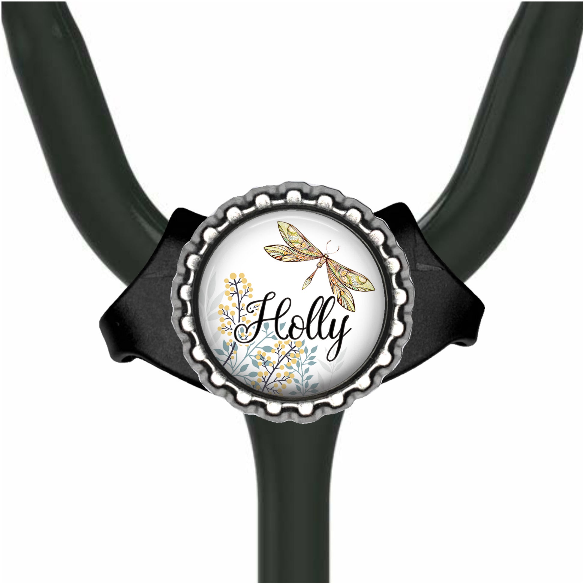 A black stethoscope with a round, decorative cap featuring a dragonfly and the word "Holly" written on it.