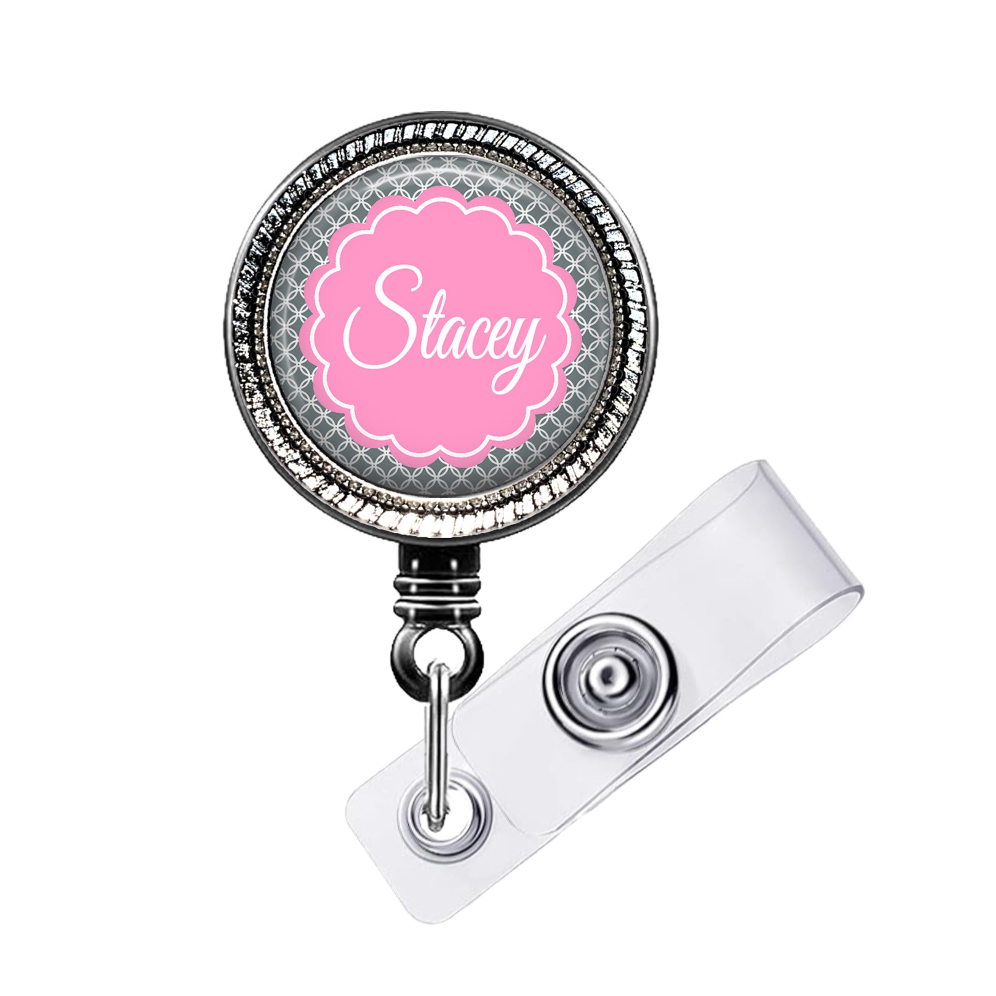 A personalized badge or lanyard with the name "Stacey" printed on it in a pink color.
