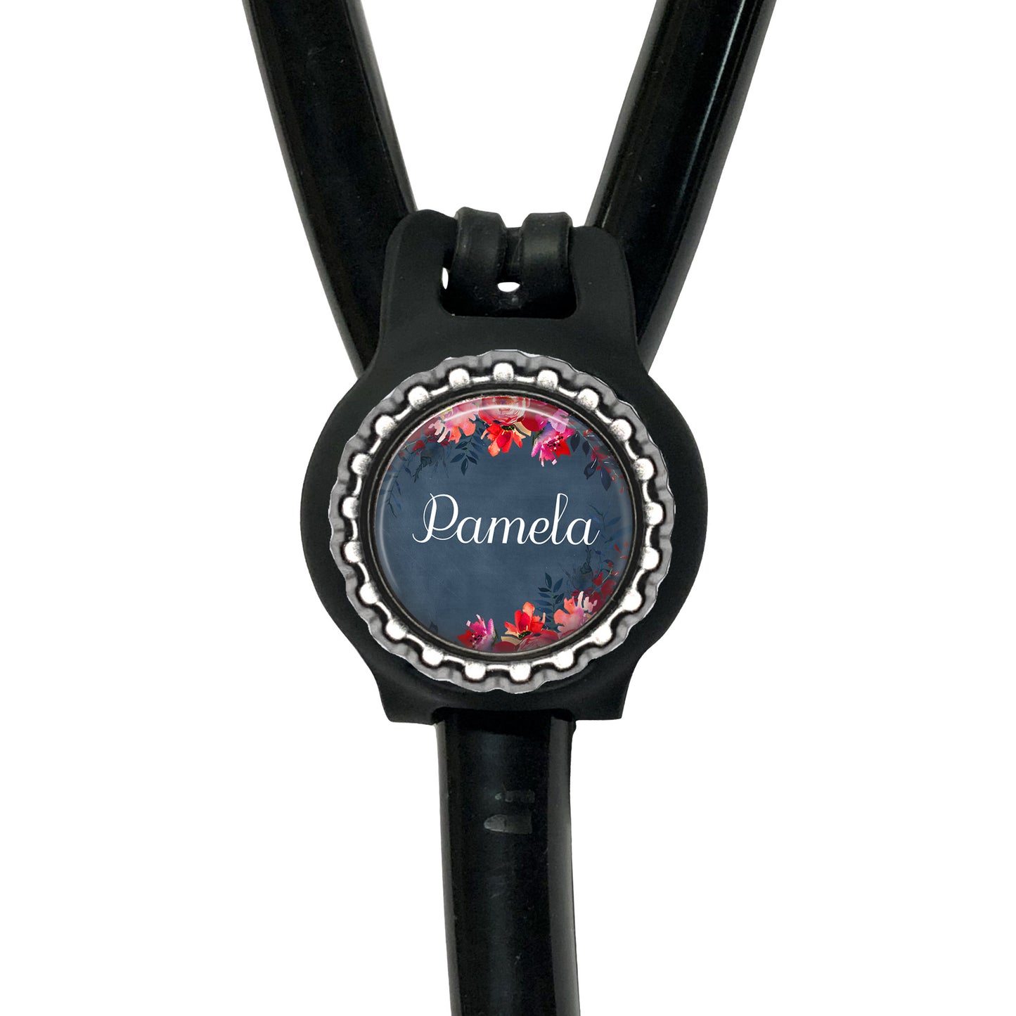 A black stethoscope with a personalized name badge attached to it.