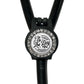 A black and white medical device with a decorative charm featuring a skeleton and the text "The Day You Deserve".