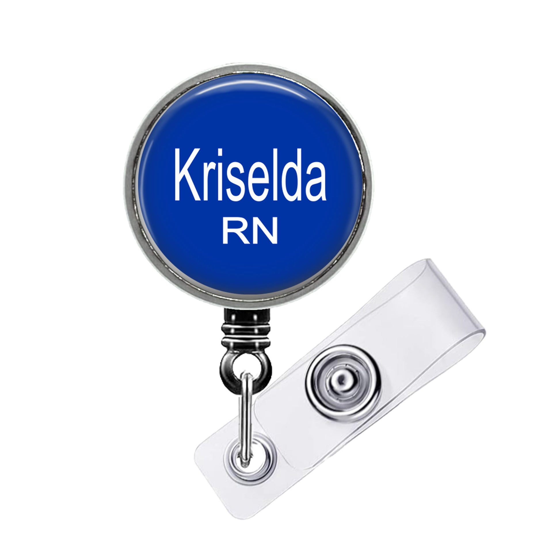 A blue badge with the name "Krisela RN" printed on it, attached to a clear badge holder.