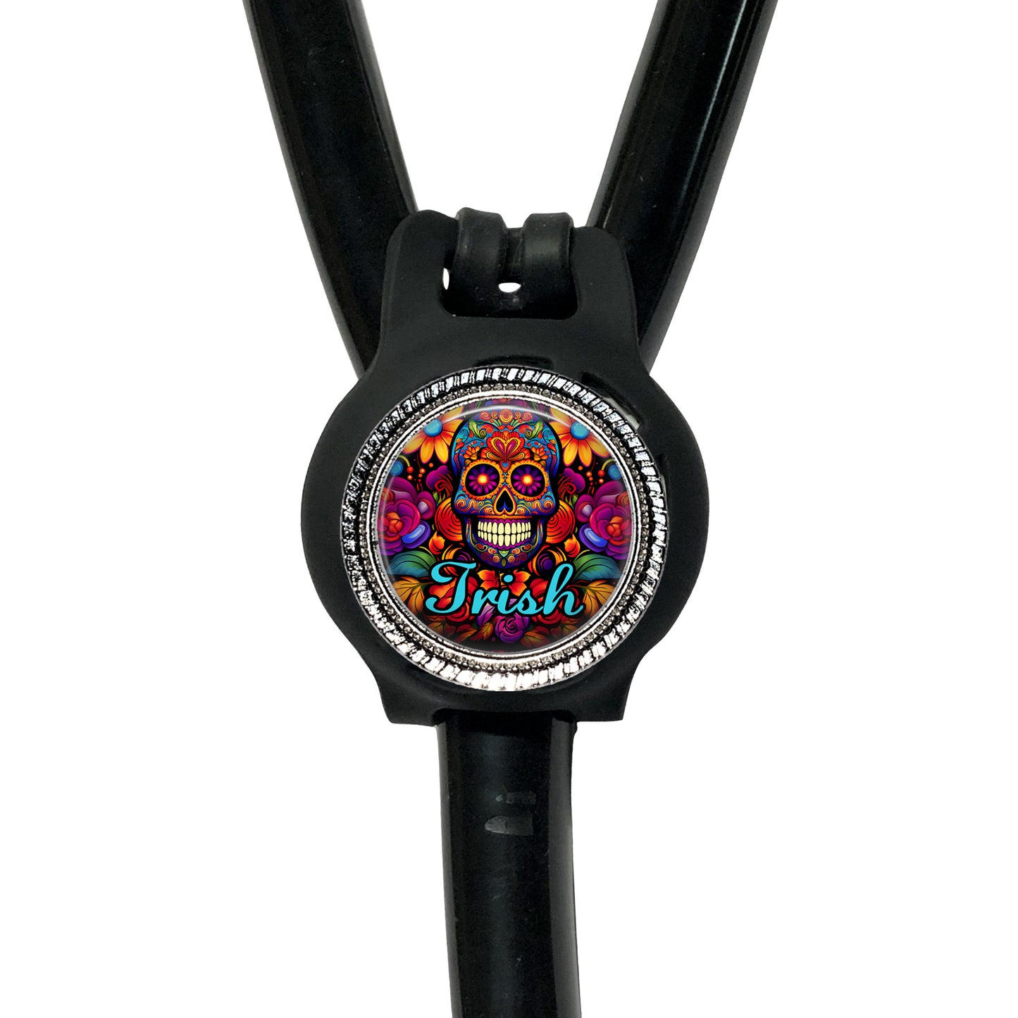 A black stethoscope with a colorful, circular charm featuring a skull design and the word "Irish" written on it.
