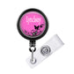 A pink badge holder with the name 'Lyndsay' printed on it, along with a clear plastic clip.
