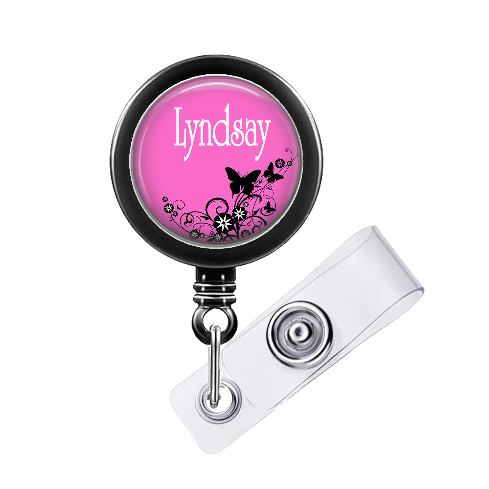 A pink badge holder with the name 'Lyndsay' printed on it, along with a clear plastic clip.
