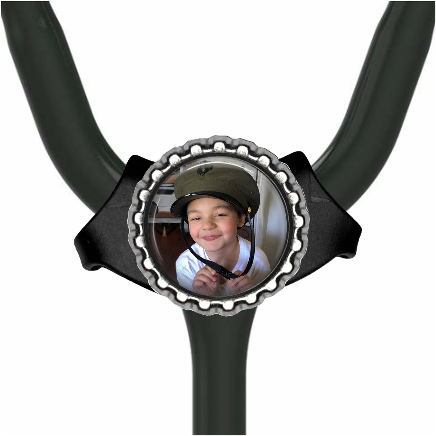A young boy wearing a helmet is smiling at the camera, with a circular frame around the helmet.