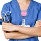 A person wearing a blue medical uniform with a stethoscope around their neck and a personalized name badge.