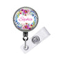 A round badge holder with a floral design and the name "Sophia" printed on it.